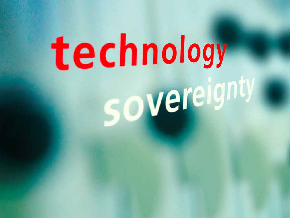 Blurry background, words "technology, sovereignty" in the foreground