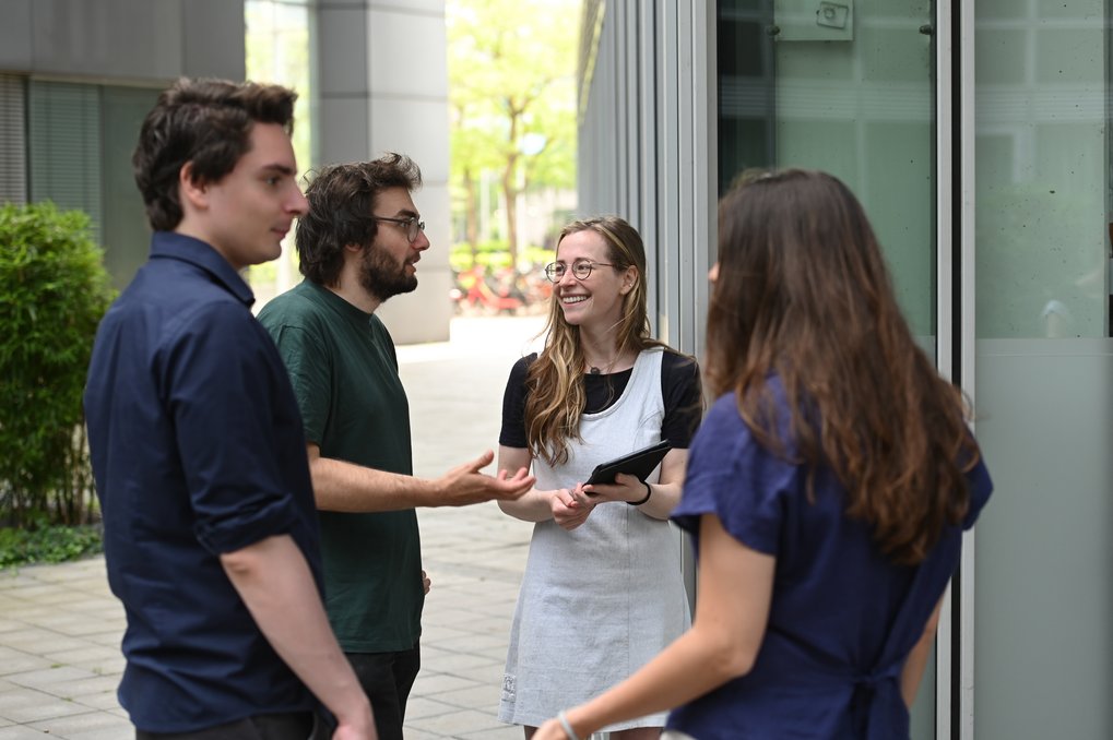 Group of employees talking and laughing