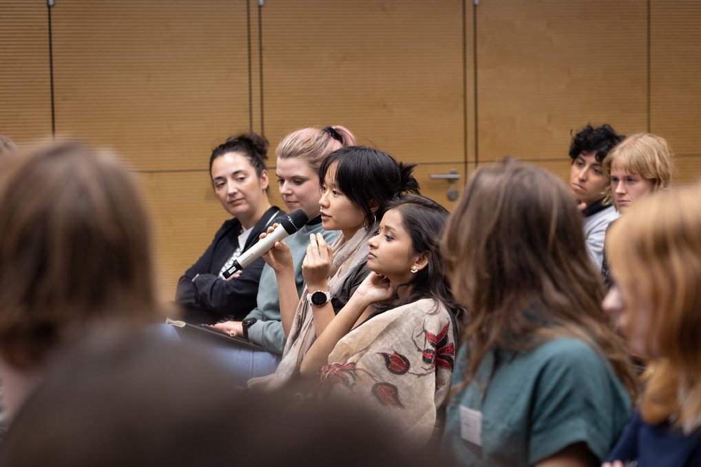 Audience member at a panel asking a question