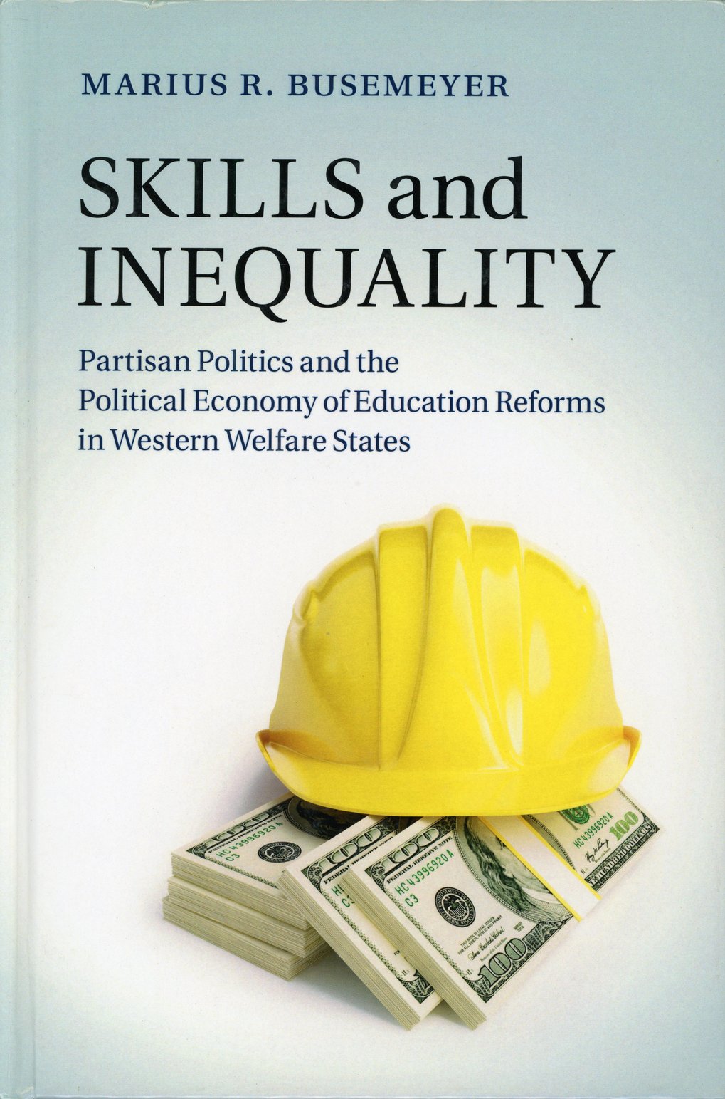 Book cover shows a yellow hard hat on stacks of hundred-dollar bills, title “Skills and Inequality,” subtitle on the political economy of education reform.