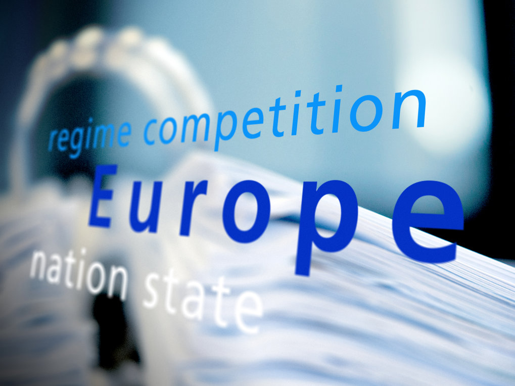 Illustration with the words “regime competition/Europe/nation state” in the foreground, blurred image of a file folder in the background