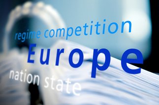 Illustration with the words “regime competition/Europe/nation state” in the foreground, blurred image of a file folder in the background